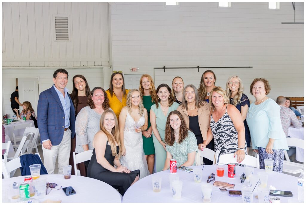 bride posing with her friends at Arlington Acres summer wedding