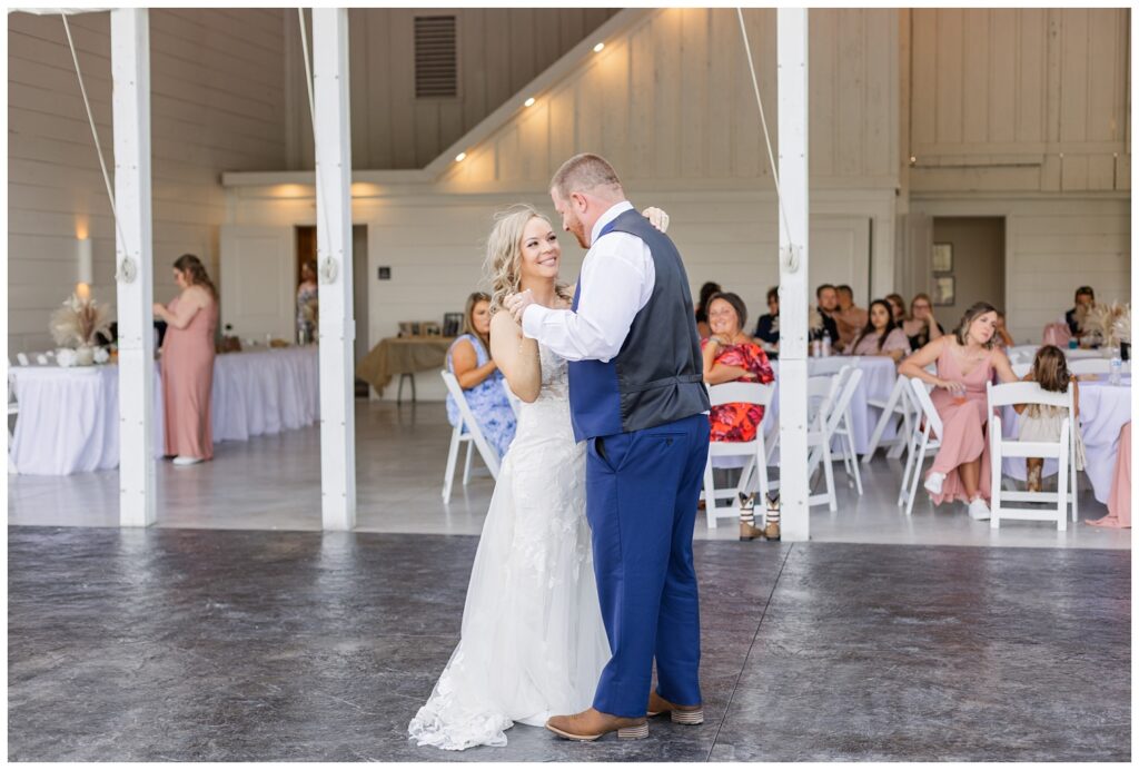 bride having first dance with the groom outside at Arlington Acres wedding venue