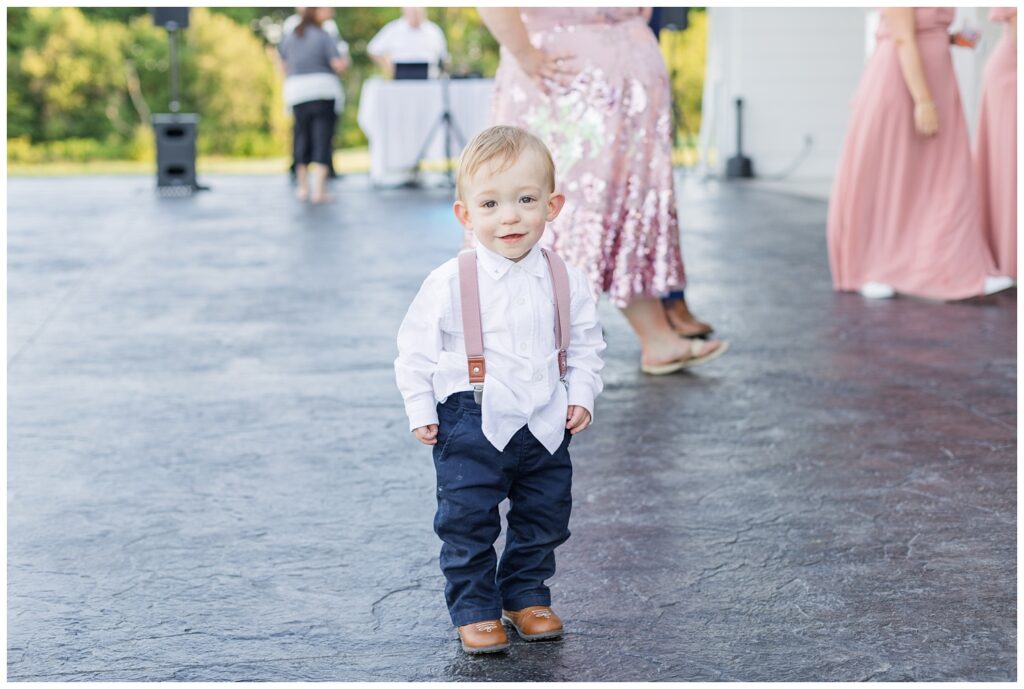 small child posing on the dance floor outside at Arlington Acres