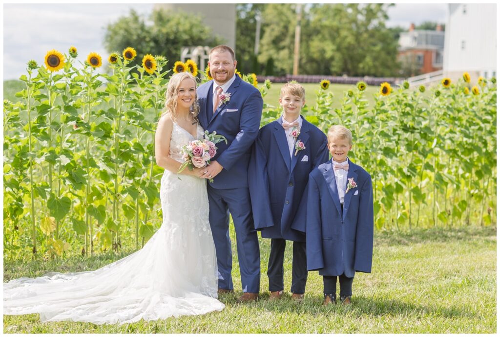 bride and groom's sons wearing large suit jackets at Arlington Acres