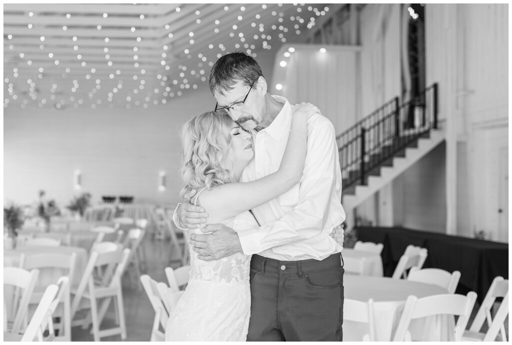 bride having a first look with her dad before the wedding ceremony