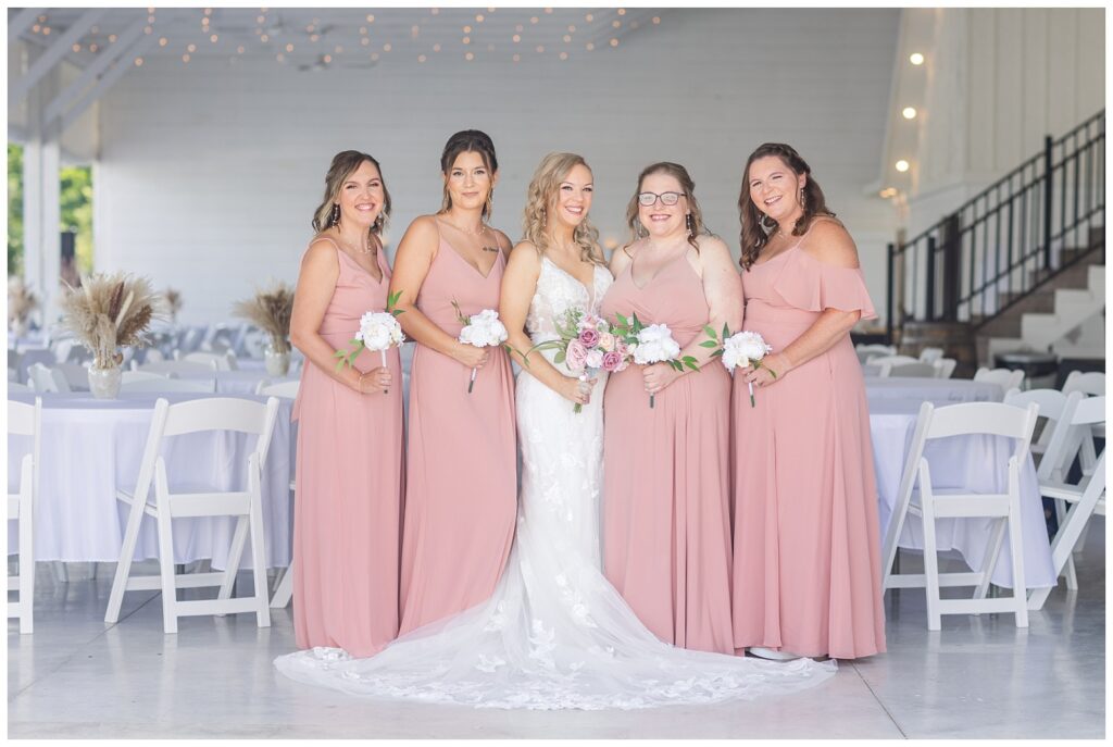 bridal party posing inside Arlington Acres wedding venue in Tiffin, Ohio