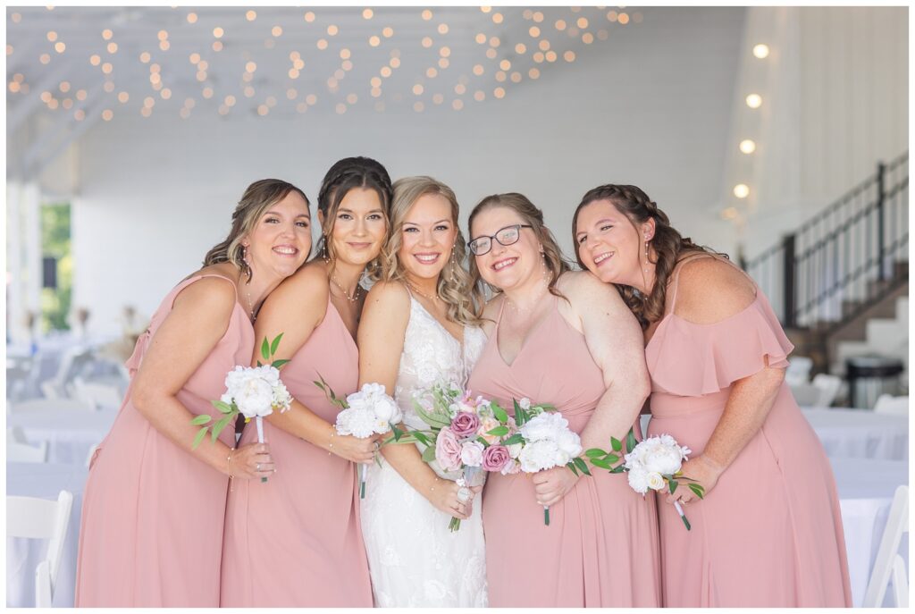 bridal party posing inside Arlington Acres wedding venue in Tiffin, Ohio