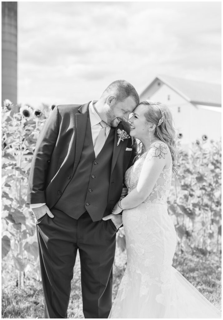 bride and groom laughing together outside at Arlington Acres wedding venue