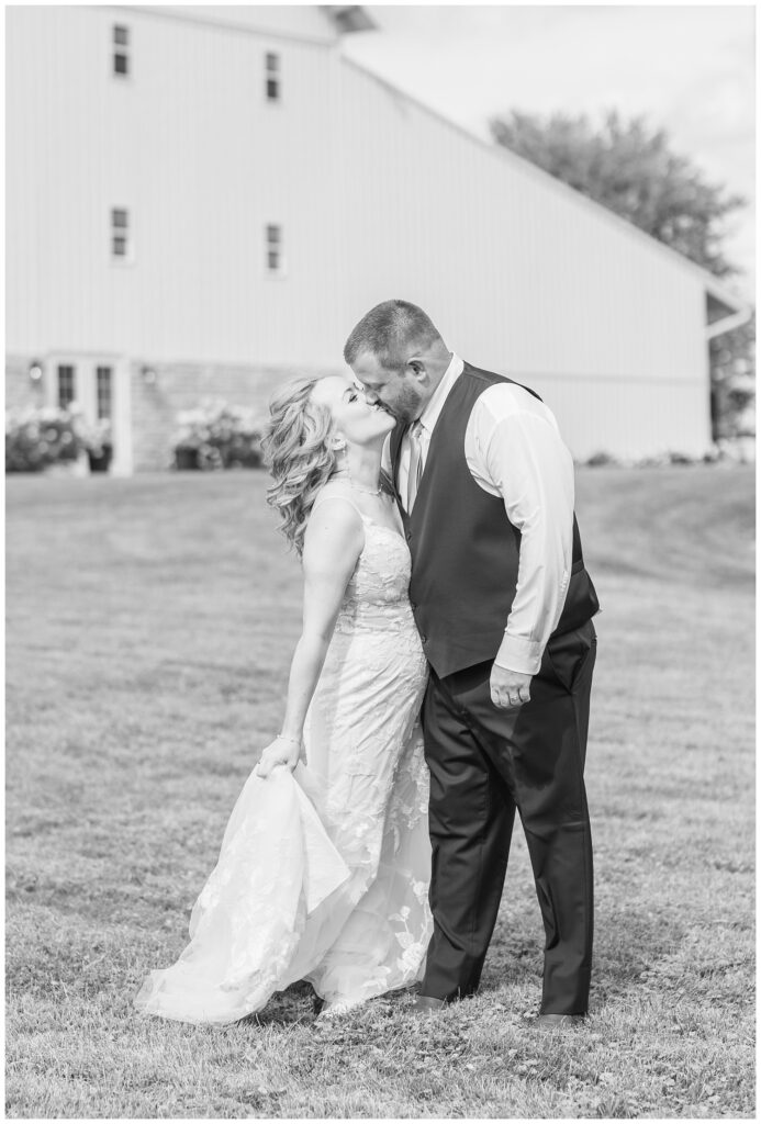 bride and groom kissing outside at Tiffin, Ohio wedding venue