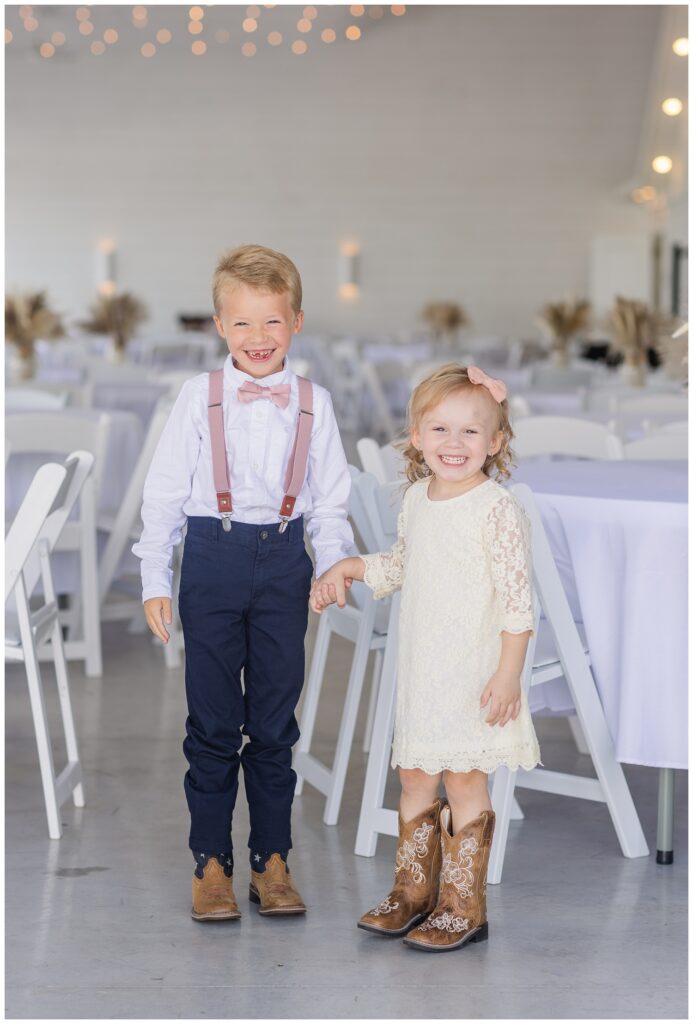 bride's children posing together inside Arlington Acres wedding venue