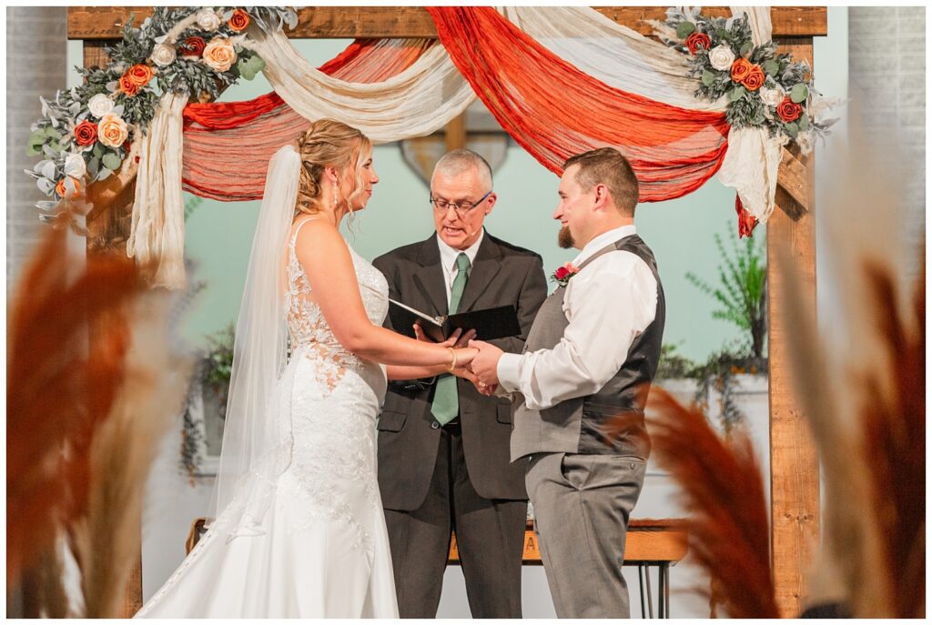 bride and groom saying their wedding vows at Norwalk Alliance Church in Ohio