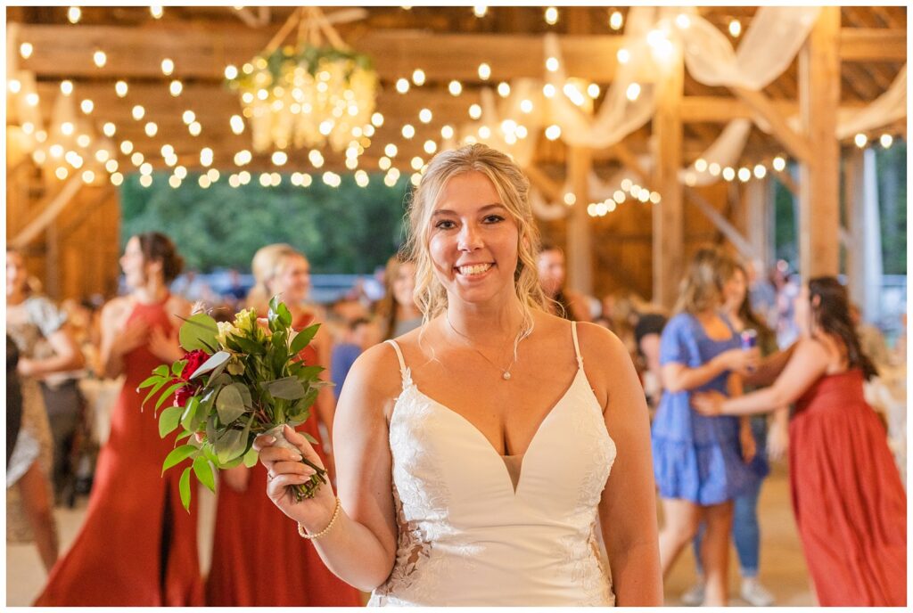 bride tossing her bouquet at wedding reception in Norwalk, Ohio