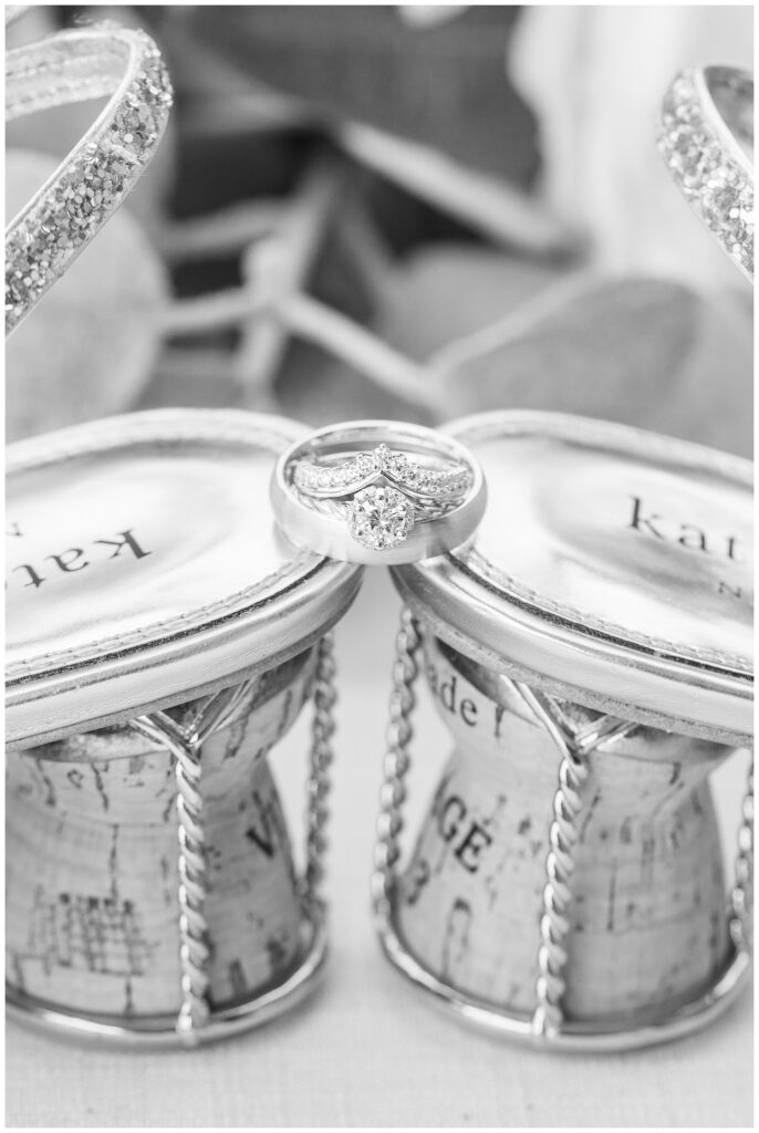 wedding rings sitting on the heels of the bride's shoes in Findlay, Ohio 