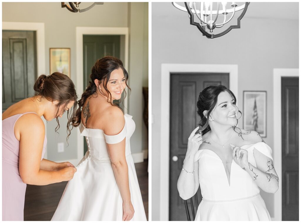 bride's maid of honor buttoning up the bride in her wedding dress