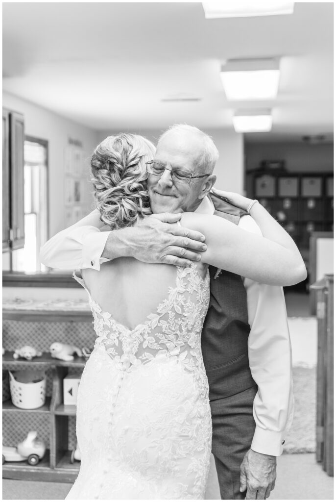 bride having a first look with their dad before the wedding ceremony