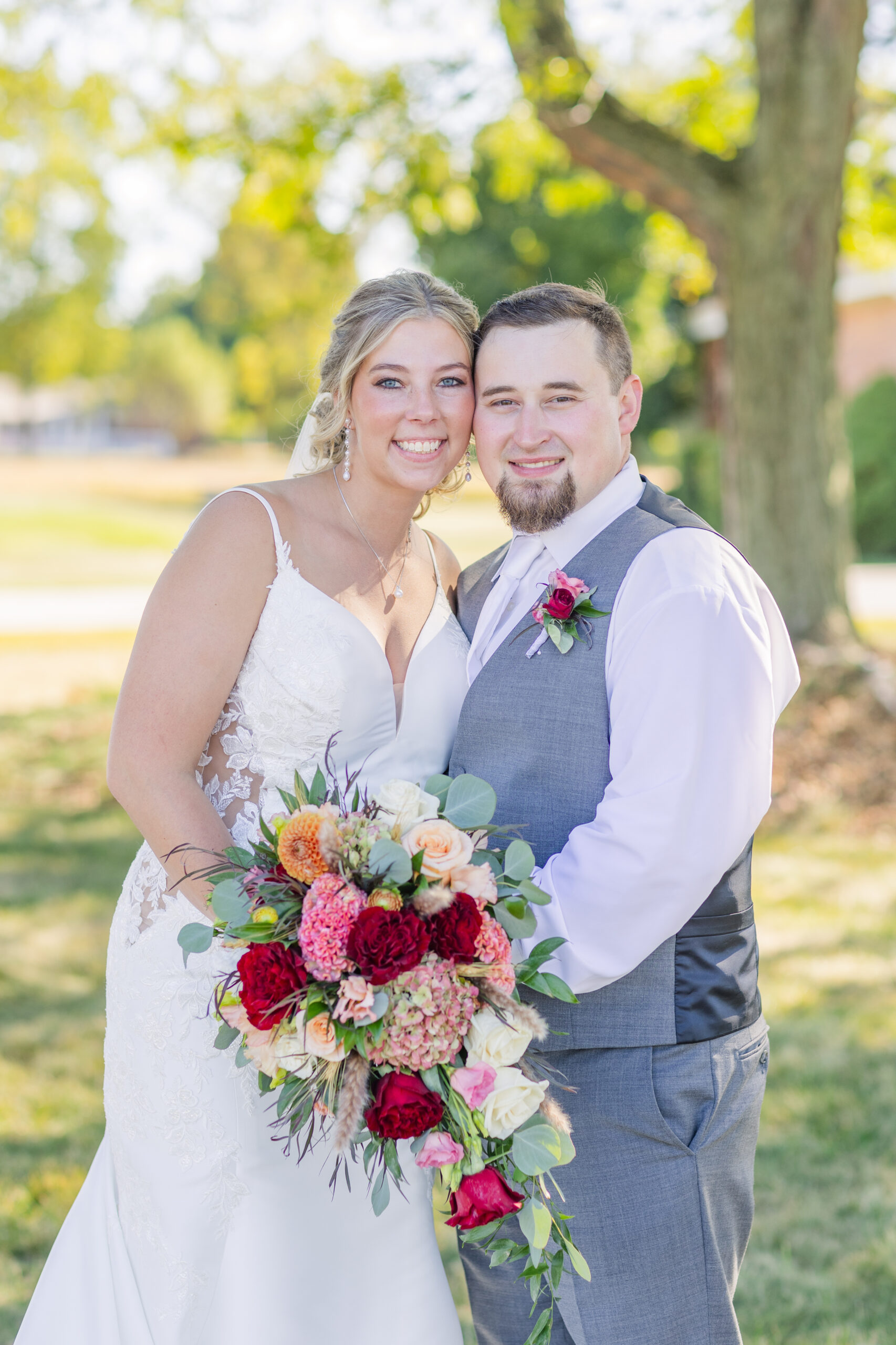 bride and groom touching cheeks for couples portraits