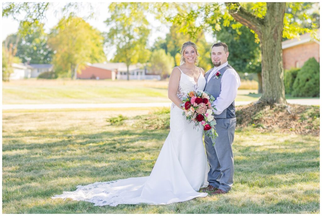 bride and groom posing together outside after the church ceremony 