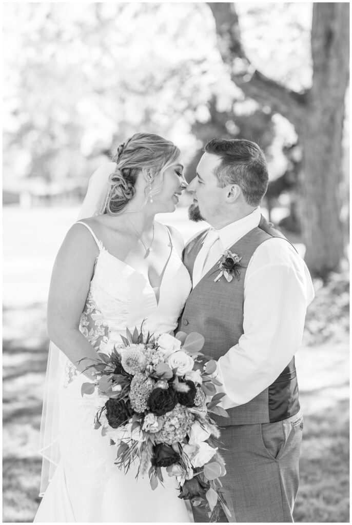 bride and groom going in for a kiss after their Norwalk Alliance Church wedding