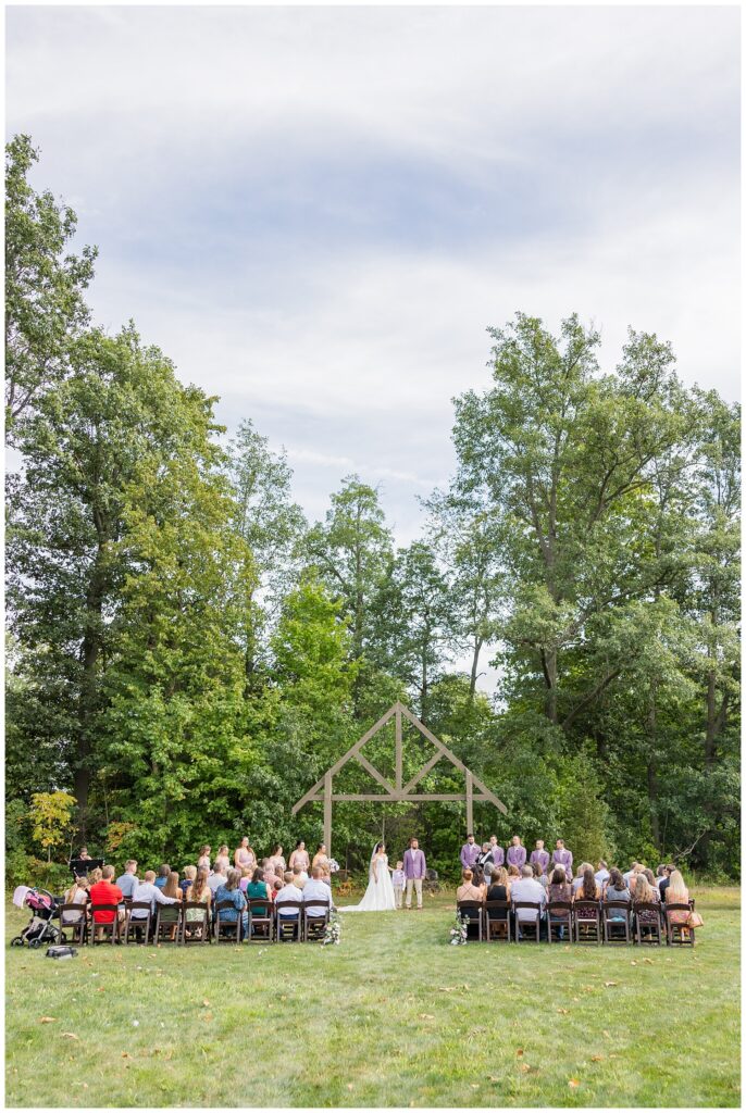 bride and groom posing with bride's son after sand ceremony in Findlay, Ohio