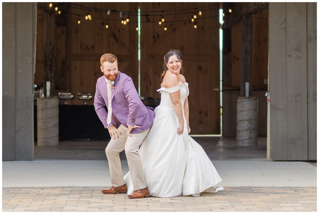 wedding couple touching butts at reception venue for introductions in Findlay, Ohio