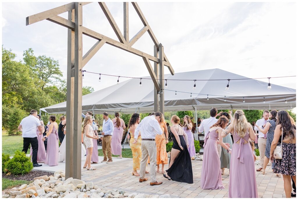 outdoors reception dancing at the Homestead by Stillwaters wedding venue