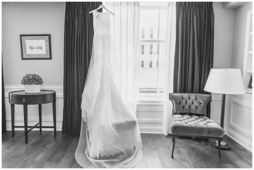 wedding dress hanging from a hotel window at The Hancock Hotel