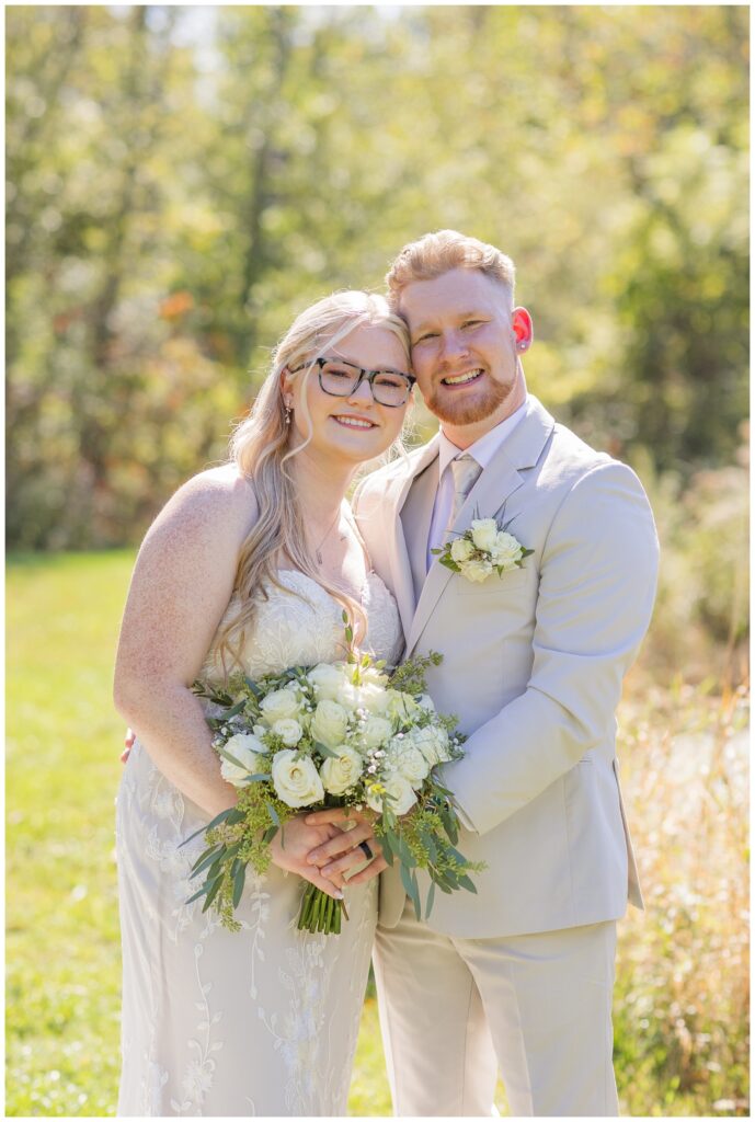 bride and groom posing together at Bradner Preserve in Bowling Green, Ohio