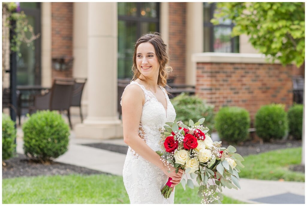 bride holding her bouquet and looking back in Findlay, Ohio