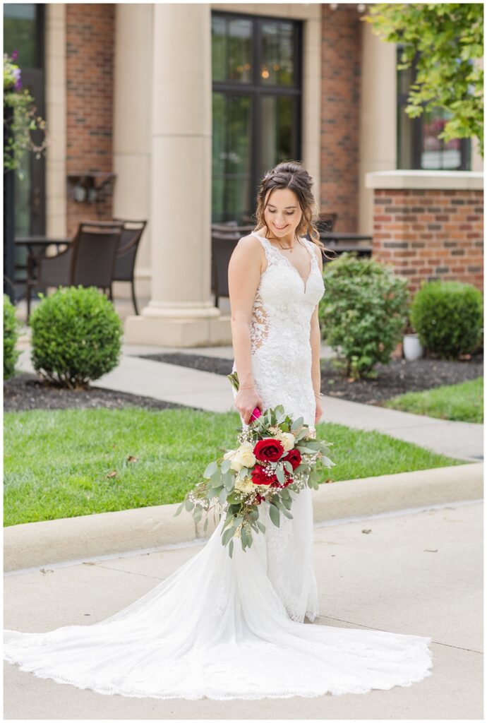 bride looking down at her shoulder and holding her wedding bouquet at The Hancock Hotel