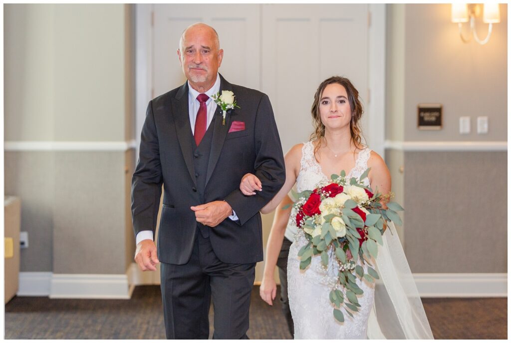 bride and her dad walking down the aisle for the ceremony in Findlay, Ohio