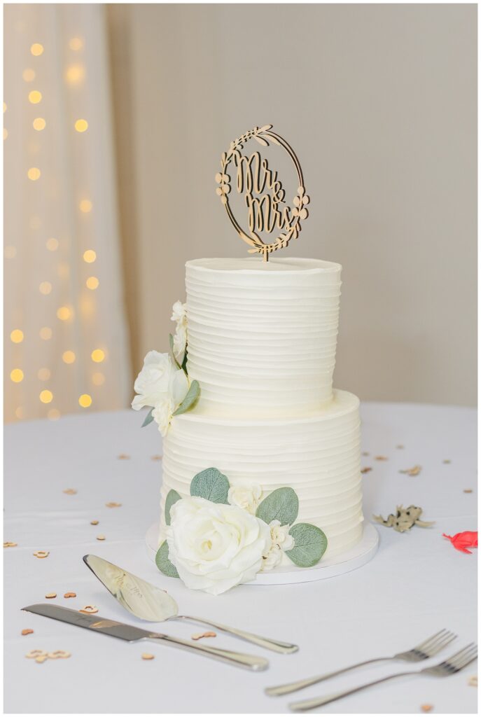 white wedding cake with floral adornments at Stacy's Place in Fostoria, Ohio