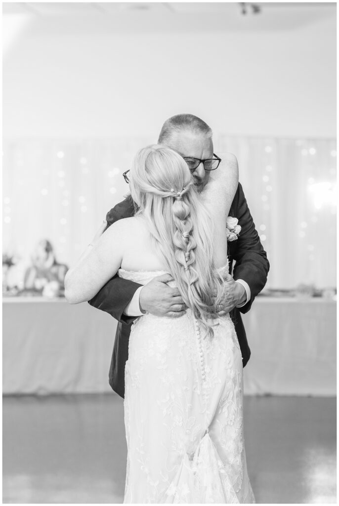 bride and her dad having a dance during the reception at Stacy's Place