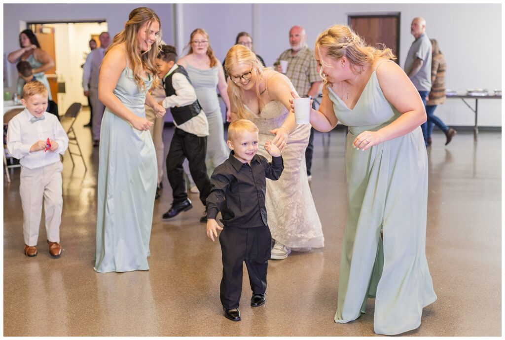 ring bearer dancing with the bridesmaids at Fostoria, Ohio wedding reception