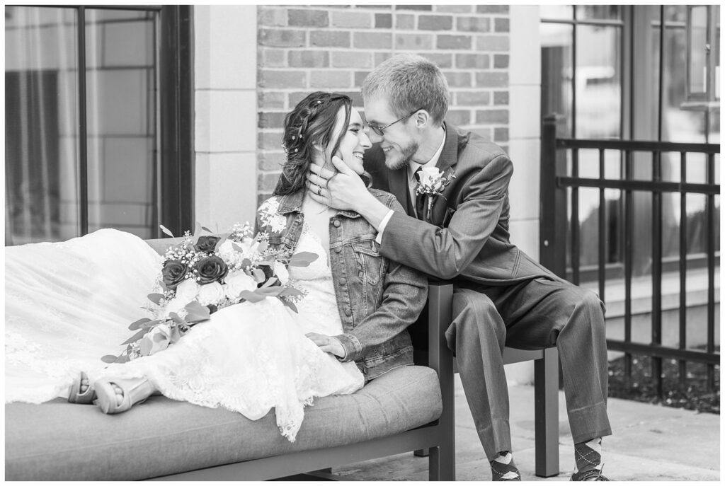 bride and groom posing outside on the patio at The Hancock Hotel in Findlay, Ohio