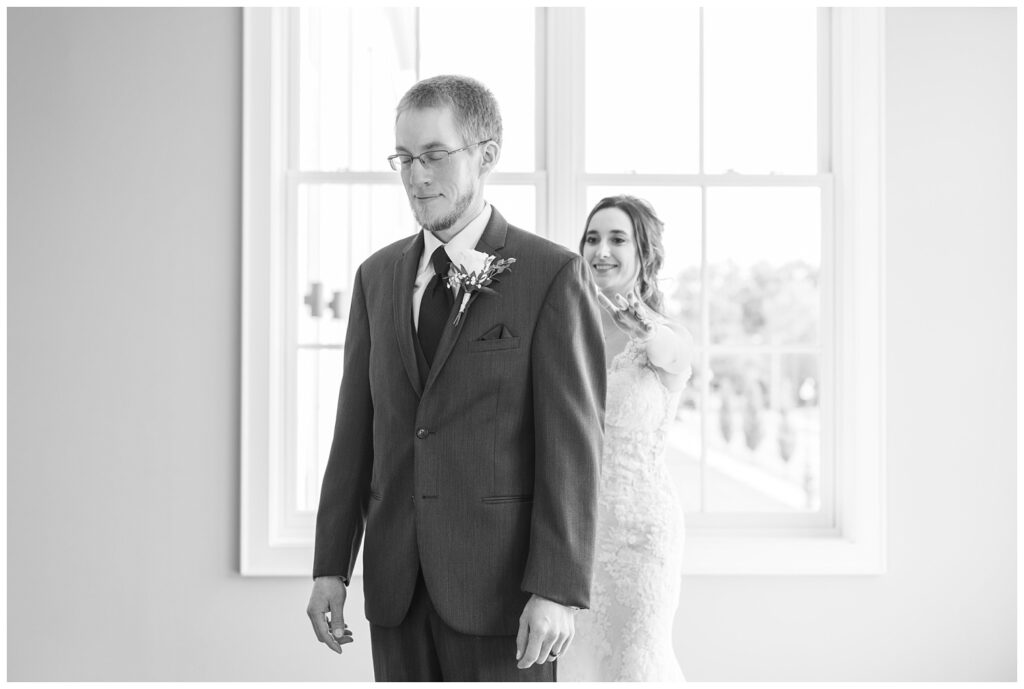 bride and groom having a first look in the hallway at The Hancock Hotel