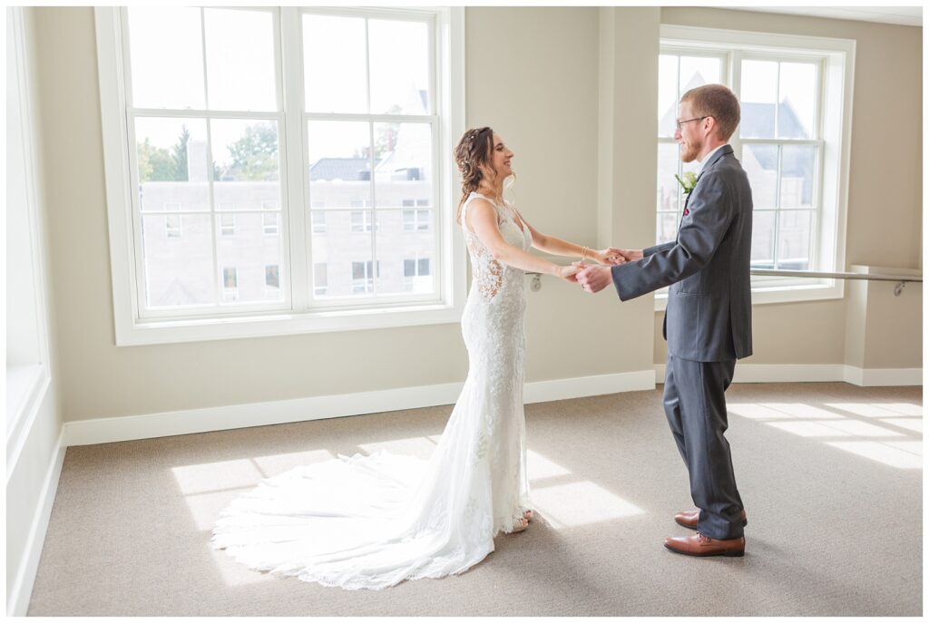 Findlay, Ohio first look between bride and groom in the hallway