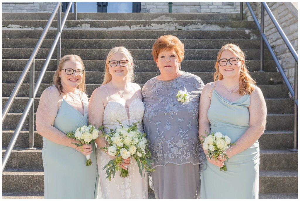 family wedding portraits next to the stairs at Thompson Stone Hall