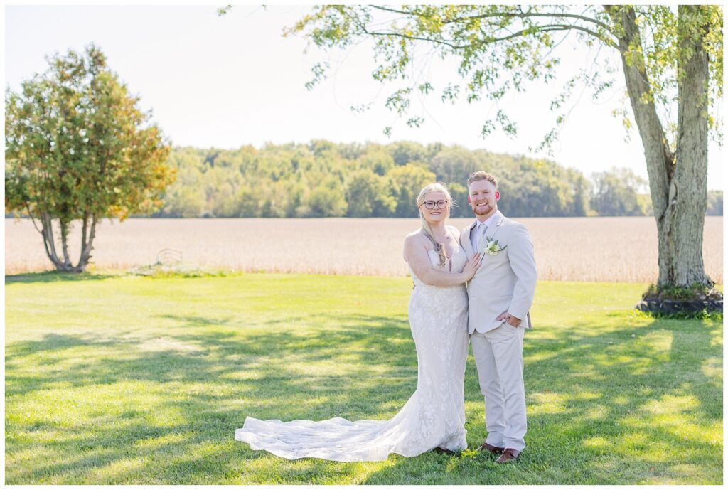 first look between the bride and groom outside in the grandma's backyard 