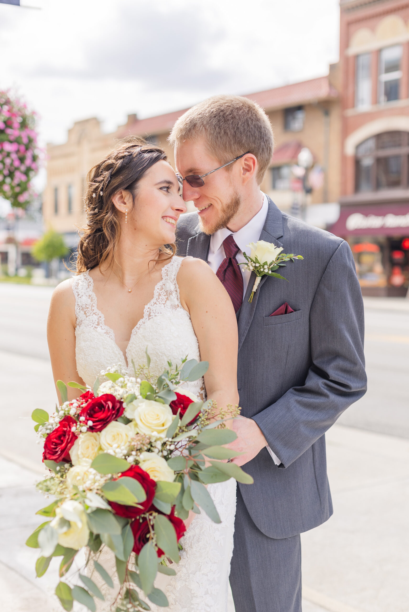 wedding couple posing on the sidewalk in Findlay, Ohio