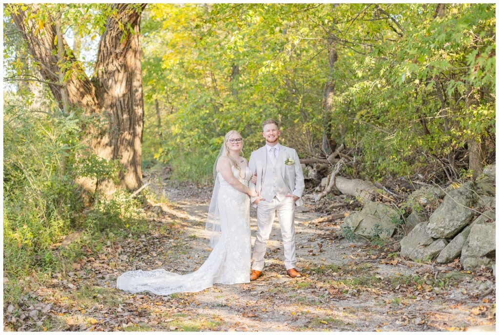 wedding couple posing on the trail in Otsego Park after ceremony