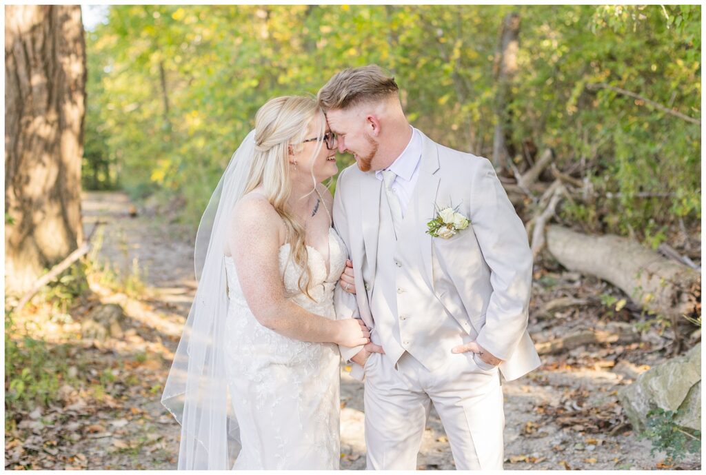 wedding couple posing on the trail in Otsego Park after ceremony