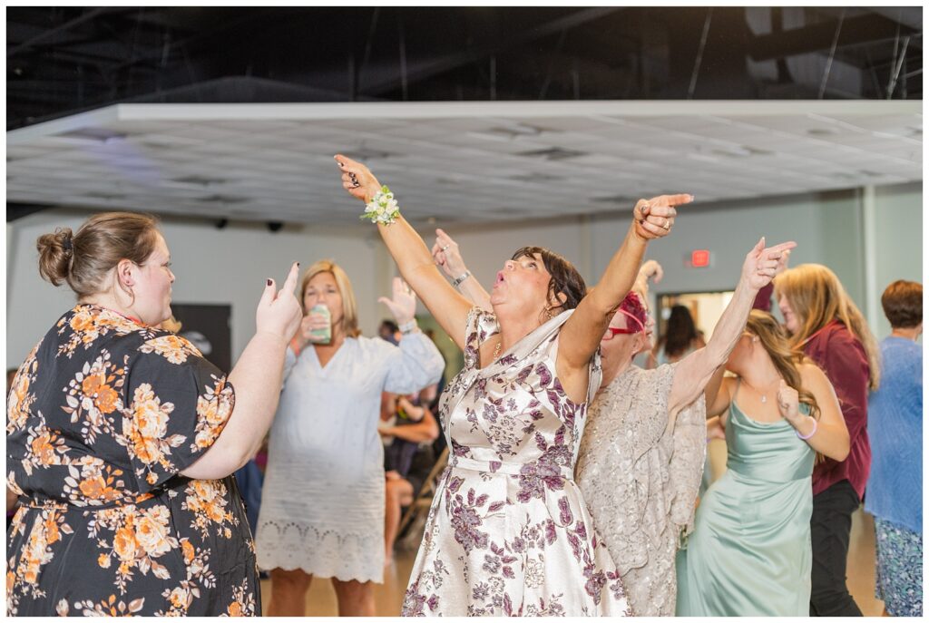 wedding guests dancing together at Fostoria, Ohio reception in the fall