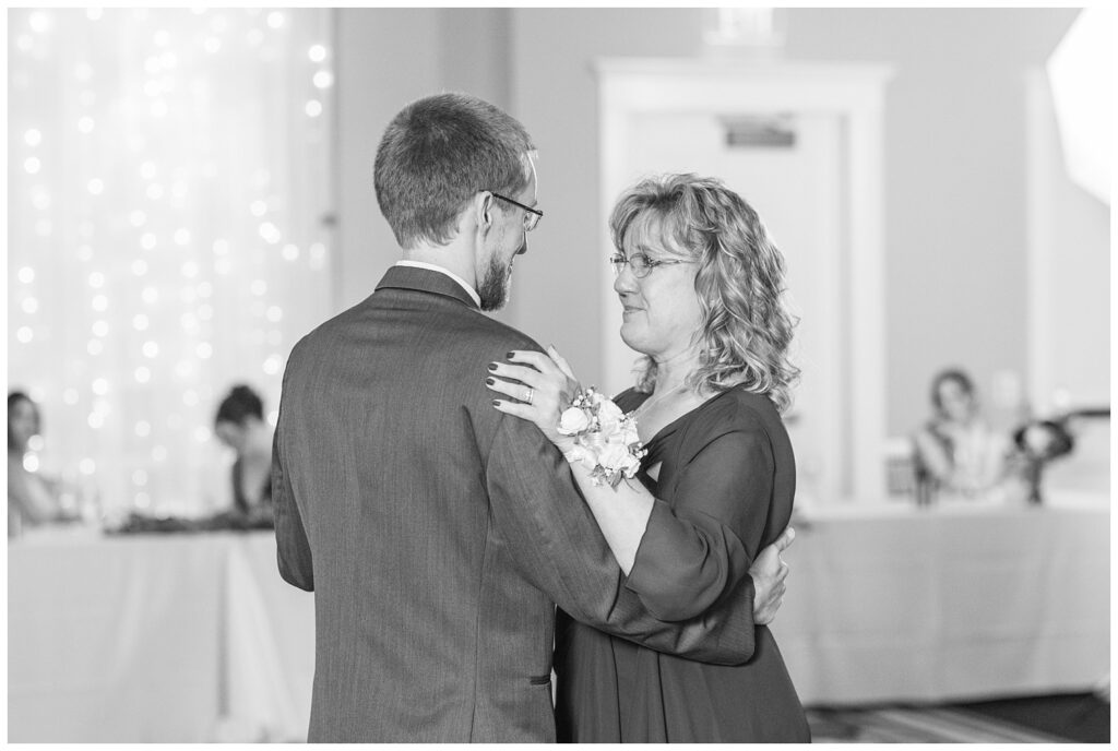 groom dancing with his mom at fall wedding reception at The Hancock Hotel