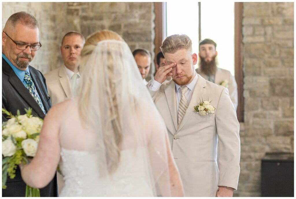 groom crying at beginning of ceremony at Thompson Stone Hall in Bowling Green, Ohio