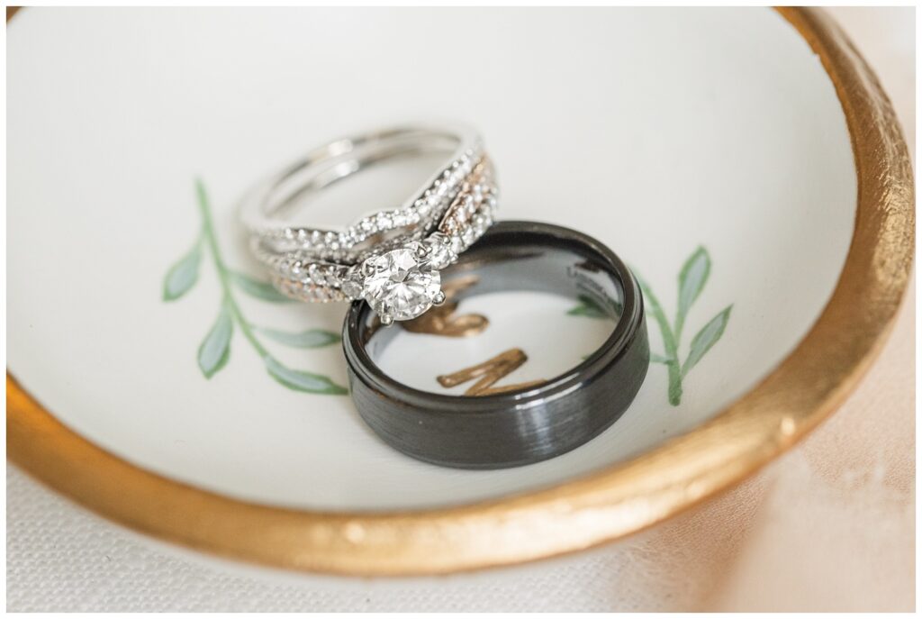 bride and groom's wedding rings sitting in a ring dish at Findlay, Ohio ceremony