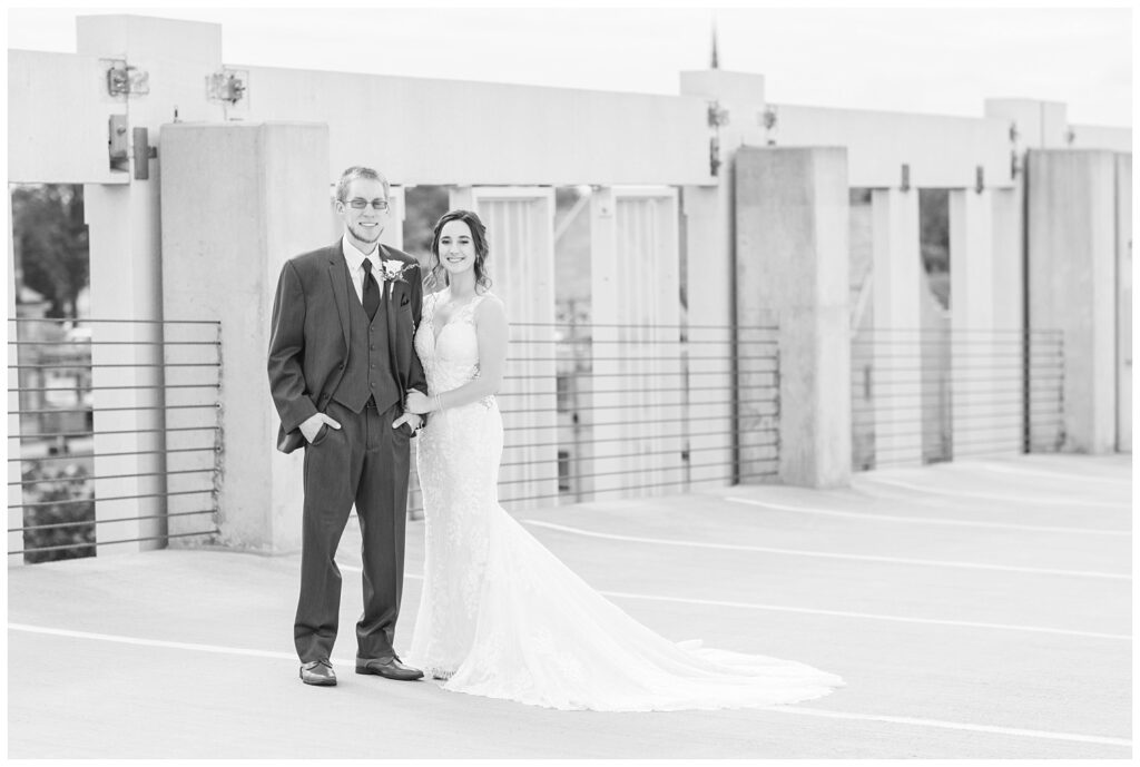 bride and groom standing on top of the parking lot deck in Findlay, Ohio