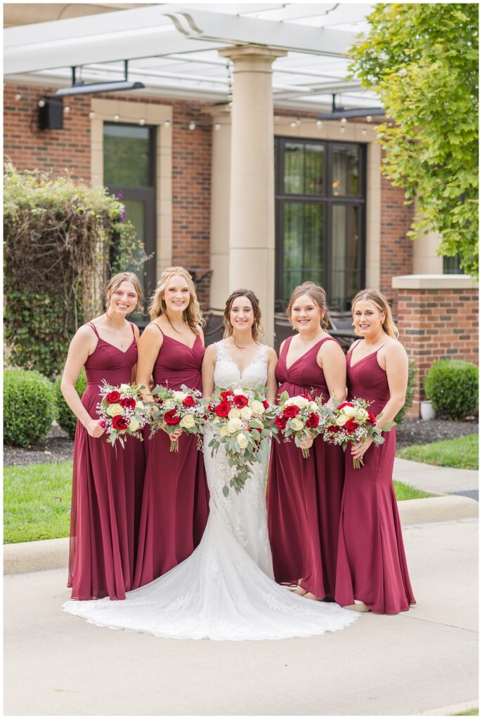 bride posing with her party outside at the hotel in Findlay, Ohio