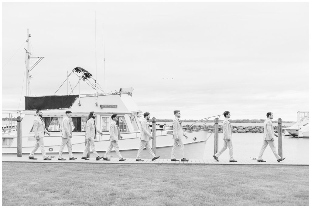 groomsmen walking in a straight line along the gangway in Sandusky, Ohio