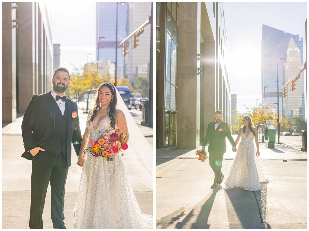 bride and groom walking hand in hand on the sidewalk in downtown Cleveland