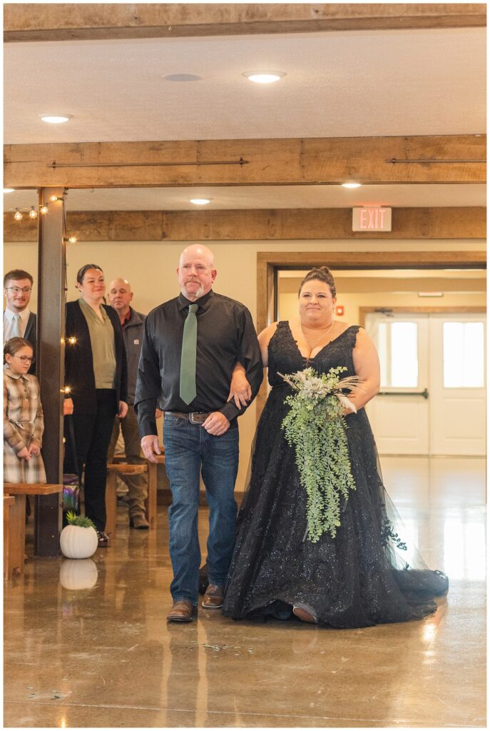 bride walking down the aisle at chapel inside Pickwick Place wedding venue