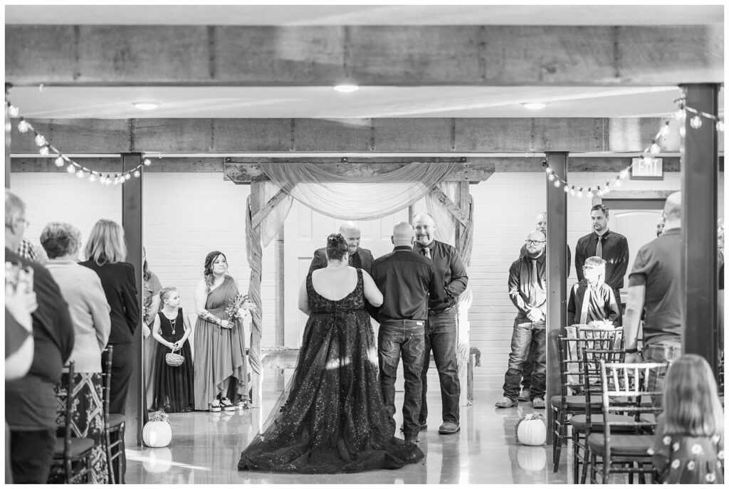 bride's dad giving her away at the chapel inside Bucyrus, Ohio wedding venue