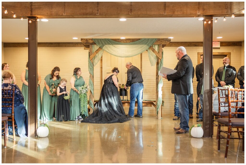 wedding couple water a special plant during the ceremony at Pickwick Place