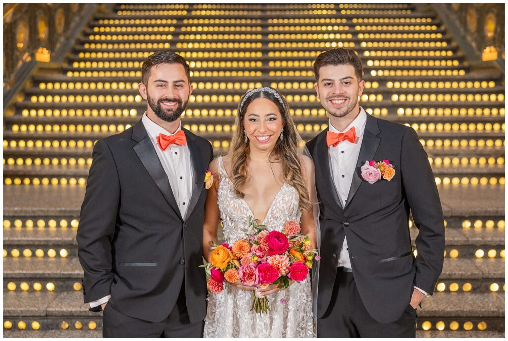 bride posing with her brothers after wedding ceremony at the Arcade Cleveland