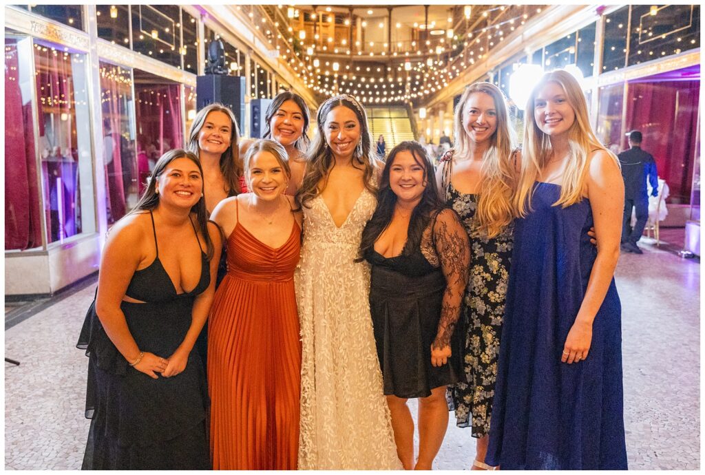 bride posing with her friends at her fall wedding reception in Cleveland, OH